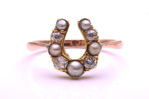 Lot 320 - A split pearl and diamond horseshoe ring,...