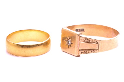 Lot 33 - A 22ct gold wedding band and a 9ct gold signet...