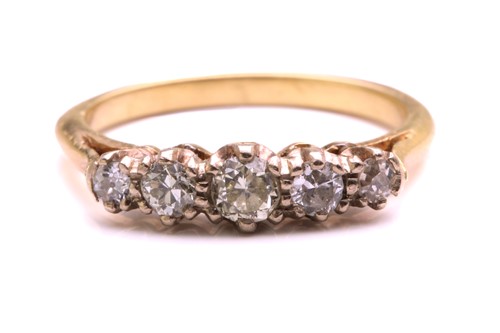 Lot 234 - A yellow metal and diamond ring, set with five...