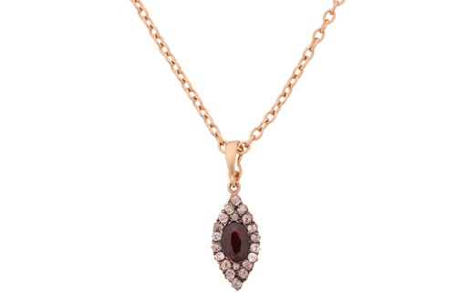 Lot 146 - A diamond and garnet pendant, of elongated...