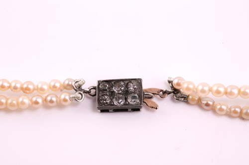 Lot 23 - A graduated two-row cultured pearl necklace...
