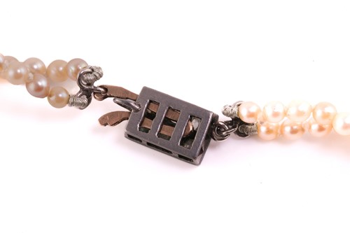 Lot 23 - A graduated two-row cultured pearl necklace...