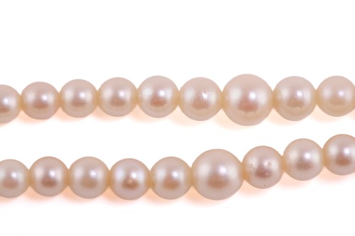 Lot 23 - A graduated two-row cultured pearl necklace...