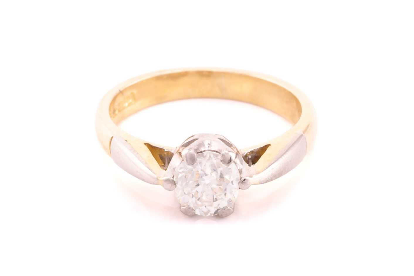 Lot 110 - A diamond solitaire ring in 18ct bi-coloured