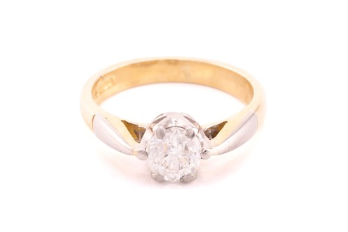 Lot 110 - A diamond solitaire ring in 18ct bi-coloured...