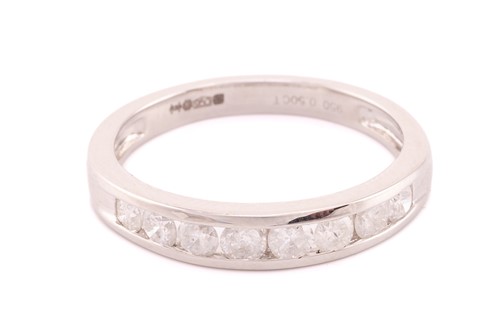 Lot 347 - A half hoop platinum and diamond eternity ring;...