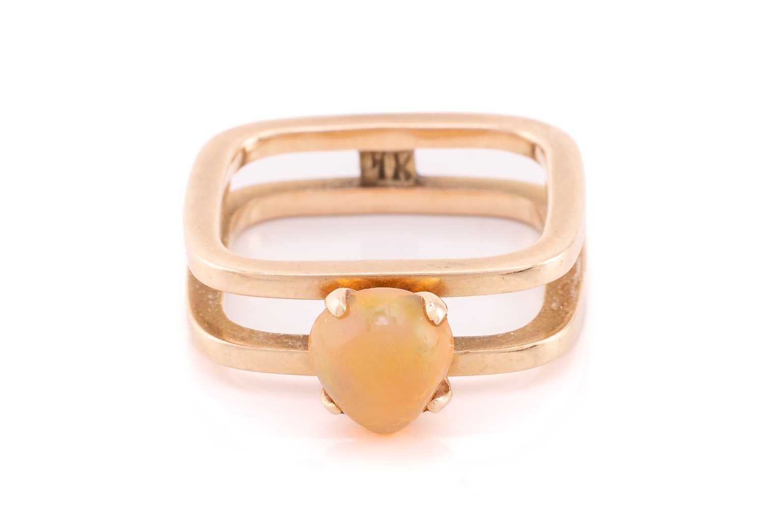 Lot 7 - An Ethiopian fire opal ring, consisting of a...