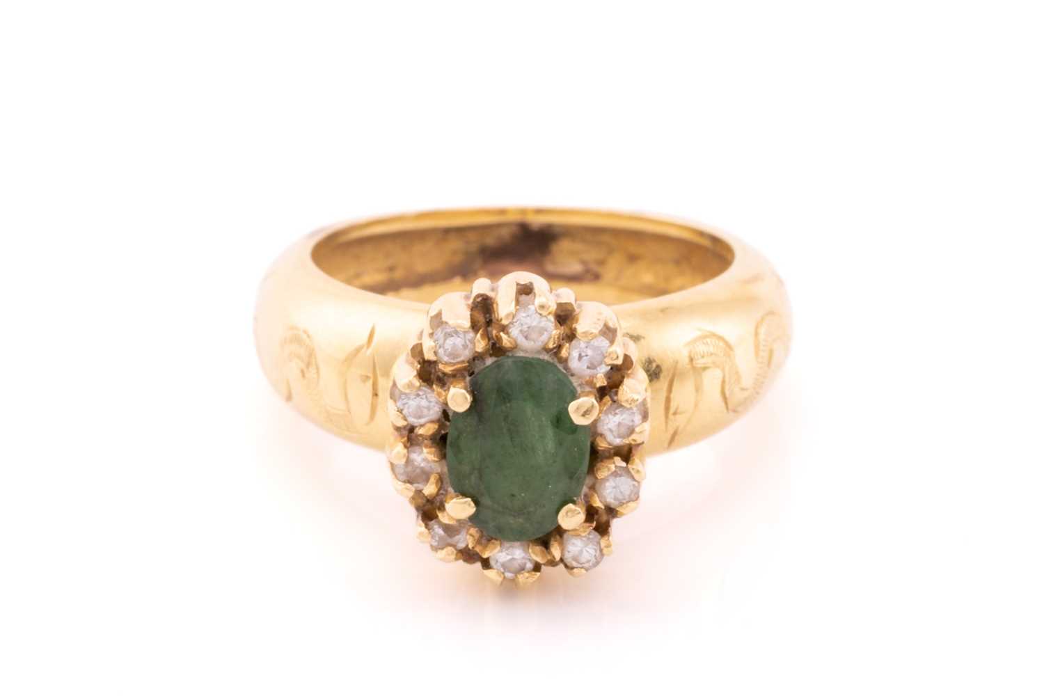 Lot 24 - A yellow metal, diamond, and emerald cluster...