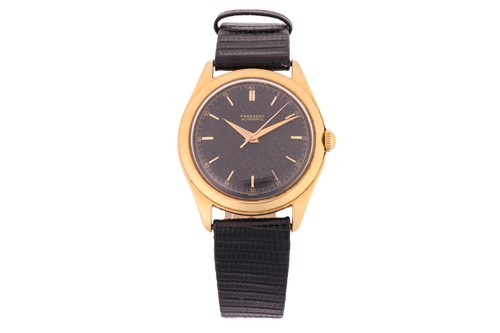 Lot 394 - A Praesent gold wristwatch, featuring...