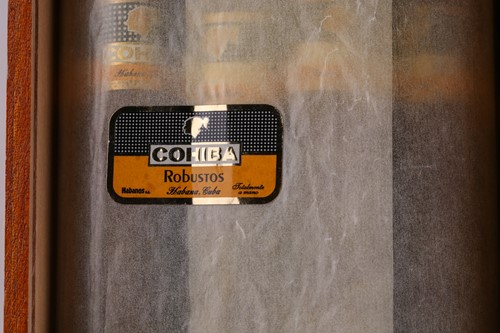 Lot 135 - 25 Cohiba Robusto Cigars in an opened slide...