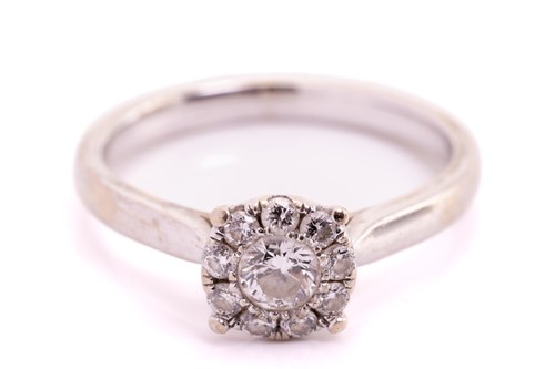 Lot 304 - A diamond cluster ring, with a central round...