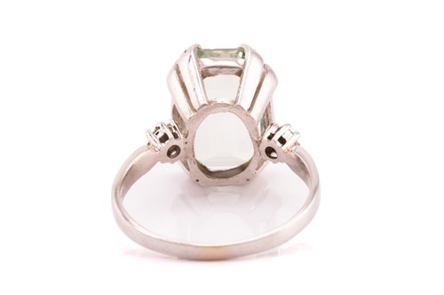 Lot 99 - A pale green beryl cocktail ring, set with a...