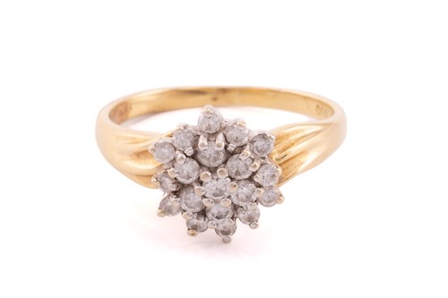 Lot 256 - A diamond cluster ring, scintillating with a...