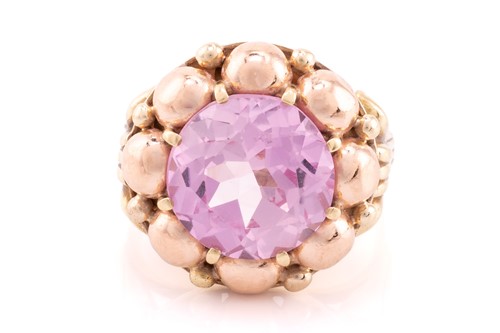 Lot 221 - A synthetic pink sapphire dress ring,...