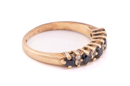 Lot 114 - A 9ct yellwo gold diamond crossover ring, set...