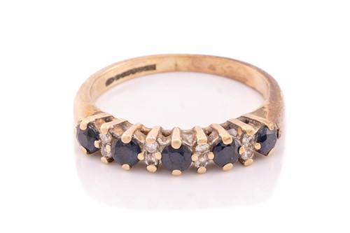 Lot 114 - A 9ct yellwo gold diamond crossover ring, set...