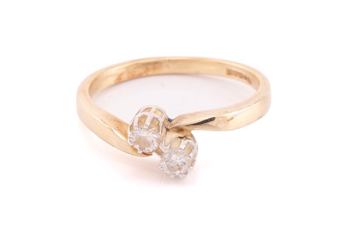 Lot 114 - A 9ct yellwo gold diamond crossover ring, set...