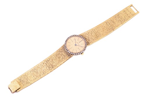 Lot 388 - A Piaget lady's diamond set wristwatch,...