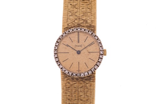 Lot 388 - A Piaget lady's diamond set wristwatch,...