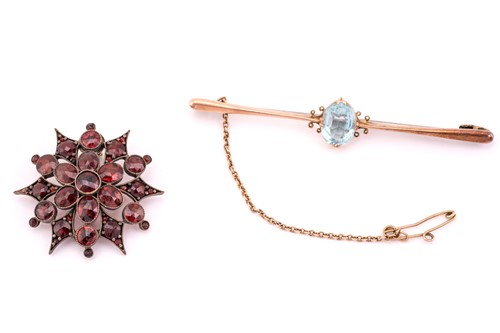 Lot 274 - A garnet star brooch and a paste bar brooch;...