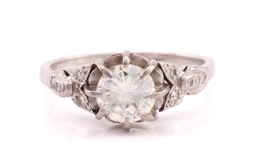 Lot 79 - A diamond dress ring, featuring a claw set...