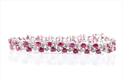 Lot 505 - An 18ct white gold, diamond, and ruby bracelet...