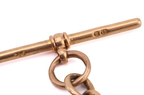 Lot 224 - An 18ct yellow gold fetter and three link...