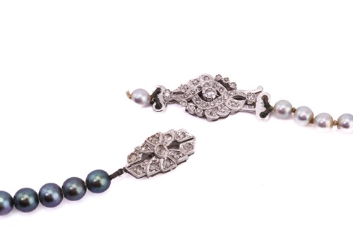 Lot 15 - Two pearl necklaces, comprising a single...