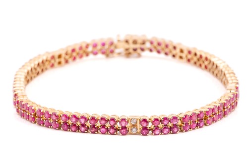 Lot 162 - A yellow metal, ruby and diamond line bracelet;...