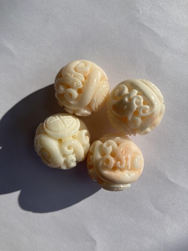 Lot 190 - Eight Chinese carved coral beads, the 21.2 mm...