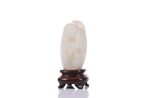 Lot 90 - A Chinese hardstone carving of a young boy...