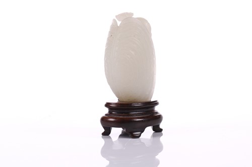 Lot 90 - A Chinese hardstone carving of a young boy...