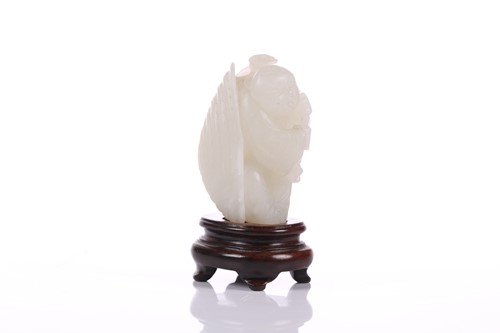 Lot 90 - A Chinese hardstone carving of a young boy...