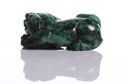 Lot 90 - A Chinese hardstone carving of a young boy...