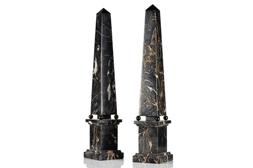 Lot 174 - A pair of variegated black marble obelisks, on...