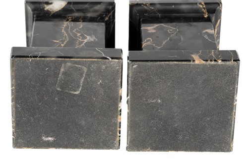 Lot 174 - A pair of variegated black marble obelisks, on...