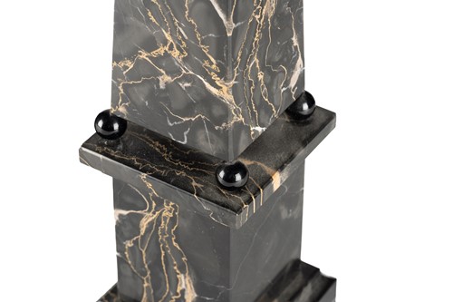 Lot 174 - A pair of variegated black marble obelisks, on...
