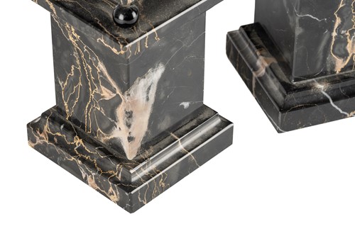 Lot 174 - A pair of variegated black marble obelisks, on...