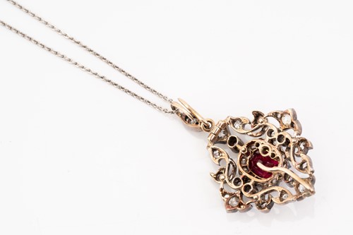 Lot 55 - A ruby and diamond pendant on chain, of...