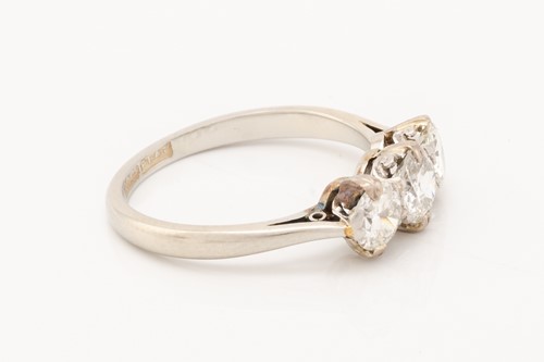 Lot 139 - A diamond trilogy ring, claw-set with...