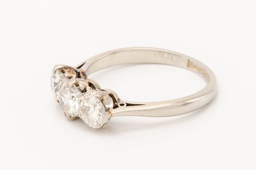 Lot 139 - A diamond trilogy ring, claw-set with...