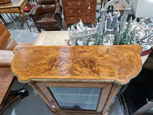 Lot 119 - A Victorian figured walnut credenza with a...