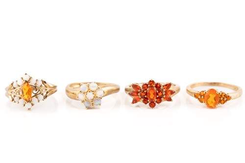 Lot 220 - Four opal cluster rings in 9ct gold; including...