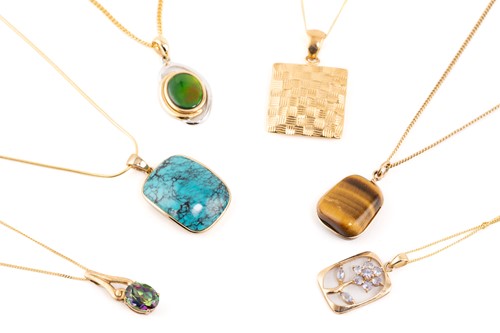 Lot 155 - A group lot consisting of six gem-set pendants...
