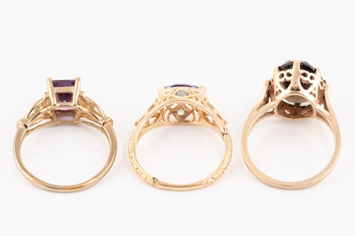 Lot 185 - Five gem-set dress rings in gold; including a...