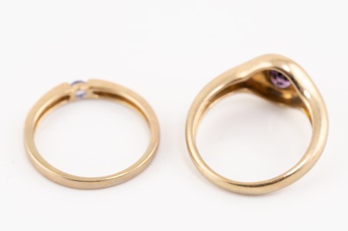 Lot 185 - Five gem-set dress rings in gold; including a...