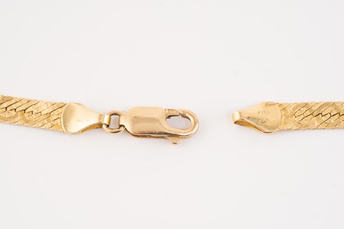 Lot 228 - A yellow metal herringbone chain necklace,...