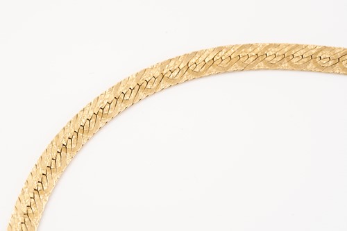 Lot 228 - A yellow metal herringbone chain necklace,...