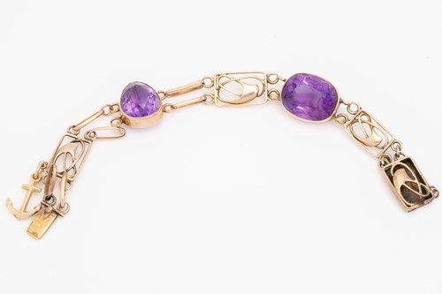 Lot 81 - A yellow metal and amethyst bracelet in the...