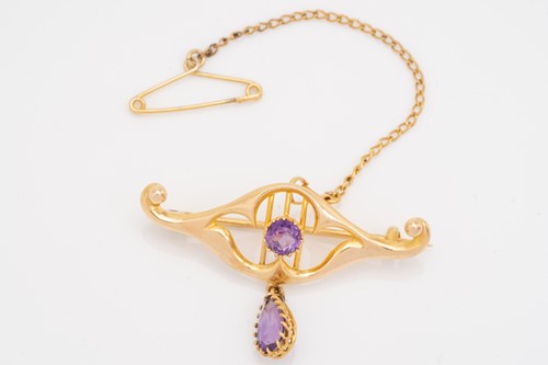 Lot 81 - A yellow metal and amethyst bracelet in the...